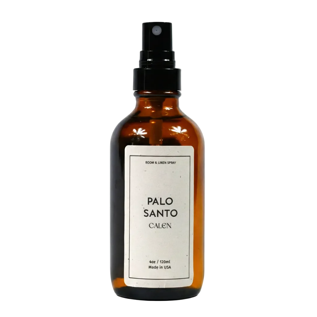 Brown spray bottle labeled 'Palo Santo Calen' on a white background