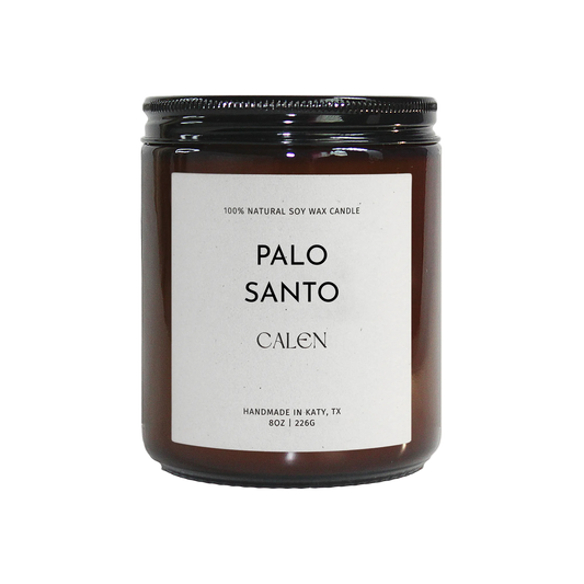 Candle labeled 'Palo Santo' by 'Calen' on a white background