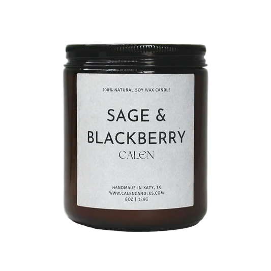 Candle jar labeled 'Sage & Blackberry' on a white background