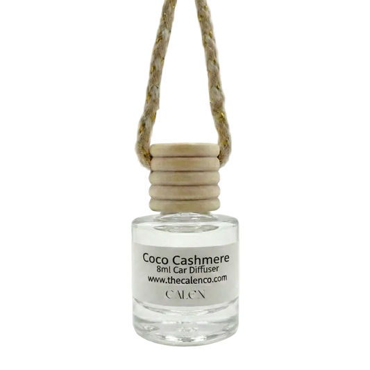 Coco Cashmere car diffuser bottle with wooden cap on a white background